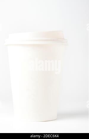 Blank white cardboard coffee cup with cap isolated on white Stock Photo