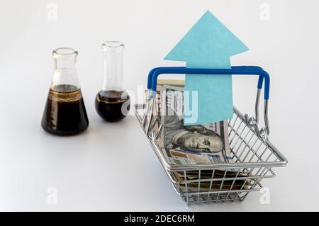 oil sample and paper banknotes. concept of rapid growth in prices for oil products. quotations of the world prices for energy carriers Stock Photo
