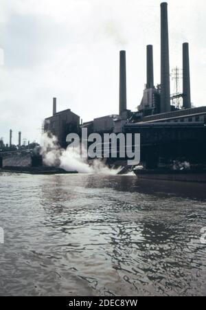 1970s Photo (1973) -  Hot water flows into the Kanawha River from the FMC corporation's South Charleston West Virginia plant. It is distilled water that was used for cooling Stock Photo