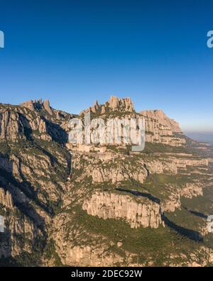 Aerial drone view of Abbey of Montserrat mountain near Barcelona in morning sunrise Stock Photo