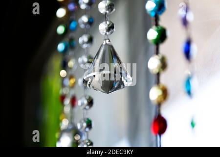 crystals and prism hanging in the window Stock Photo