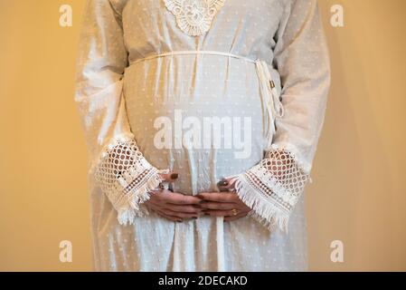 Close up of a pregnant woman's belly Stock Photo