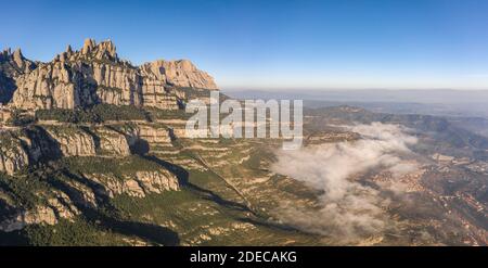 Panoramic aerial drone view of Montserrat mountain range and its valley near Barcelona Stock Photo