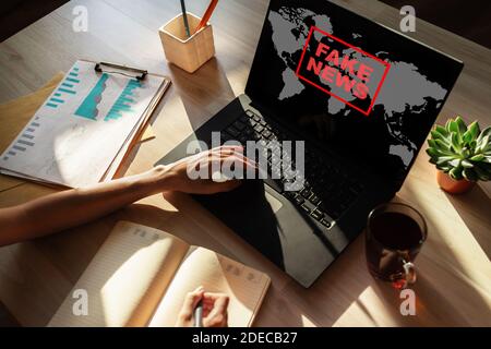 Fake news sign on screen. Propaganda and disinformation. Media and internet concept Stock Photo