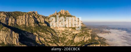 Panoramic aerial drone view of Abbey of Montserrat mountain near Barcelona in morning sunrise Stock Photo