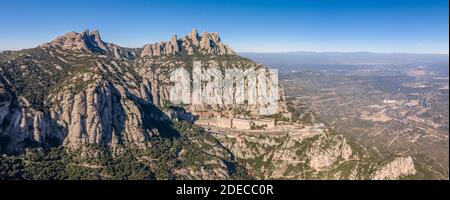 Panoramic aerial drone view of Abbey of Montserrat mountain near Barcelona in morning sunrise near Barcelona Stock Photo