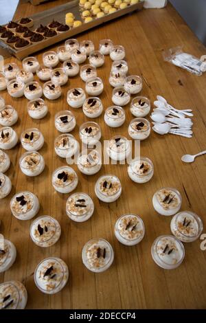 Vanilla flavoured mousse garnished with dark chocolate on a buffet table Stock Photo