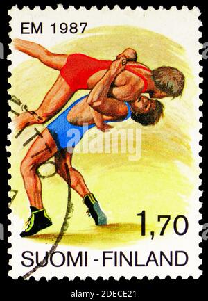 MOSCOW, RUSSIA - OCTOBER 17, 2020: Postage stamp printed in Finland shows European Wrestling Championships, circa 1987 Stock Photo