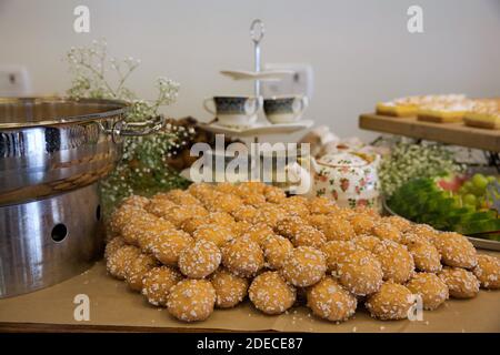 cupcakes and muffins on display on a breakfast buffet table Stock Photo