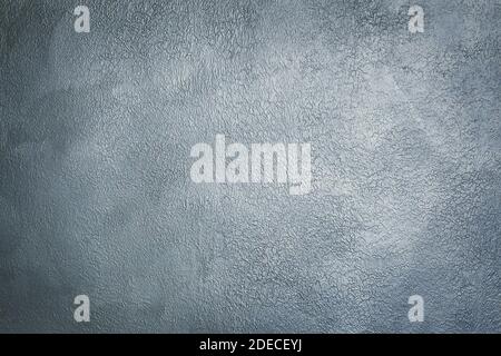 Grey textured decorative stucco for background with vignette. Stock Photo