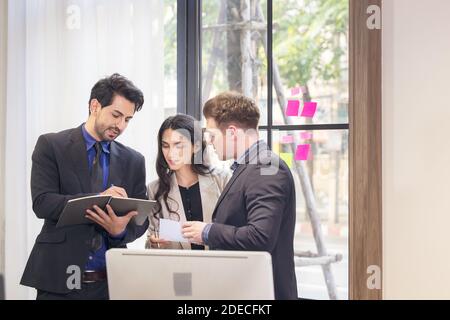 Collaboration and analysis by business people working in office Stock Photo