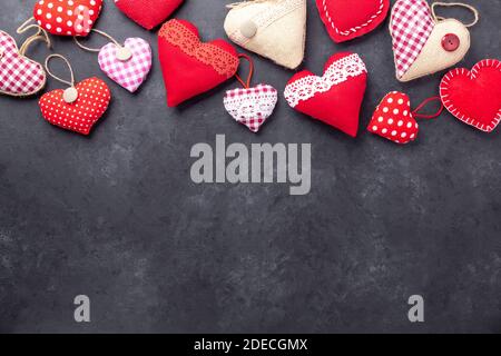 Decorative textile hearts on stone background. The concept of Valentine Day. Copy space for your text - Image Stock Photo