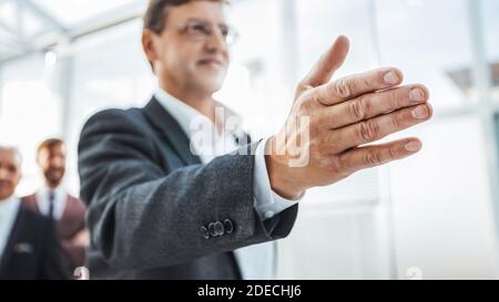business man greeting you in the new office Stock Photo