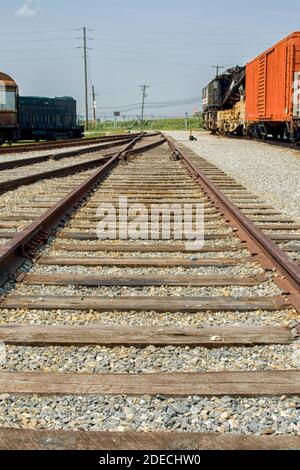 Railroad track with trains on side Stock Photo