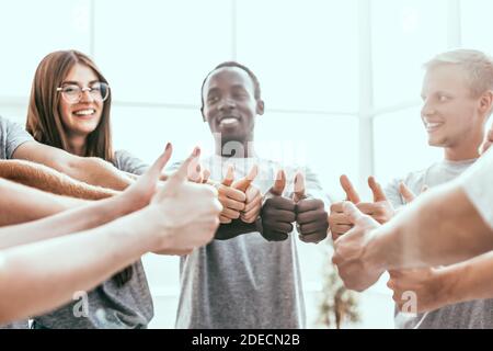 close up. group of like-minded showing thumbs up. Stock Photo