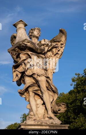 Angel with the Column on Ponte Sant Angelo bridge in Rome, Italy. Marble sculpture from 17th century by Antonio Raggi Stock Photo