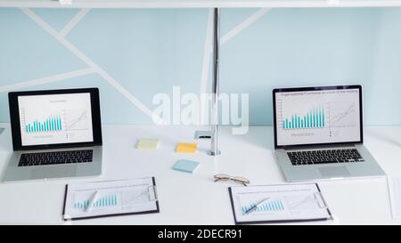 laptops and financial documents on the office Desk. Stock Photo