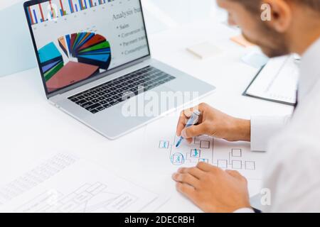 businessman analyzing financial data and making a marketing plan. Stock Photo