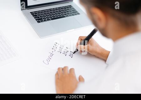 business analyst making notes about business development . Stock Photo