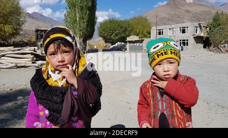 Kargil Jammu and Kashmir on 20 October 2018 Baby’s young Two children watching towards camera in kargil looking very innocent. Children or kids with h Stock Photo