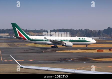 TOKYO, JAPAN - DECEMBER 5, 2016: Alitalia airline Airbus A330 taxiing at Narita Airport of Tokyo. The airport is the 2nd busiest airport of Japan (aft Stock Photo