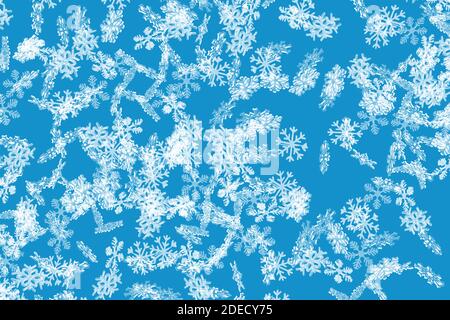 Blue frozen snowflake pattern with falling snowflakes wallpaper Stock Photo