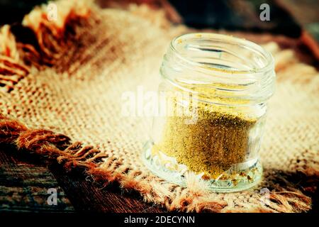 Indian spice garam masala in a glass jar, selective focus Stock Photo