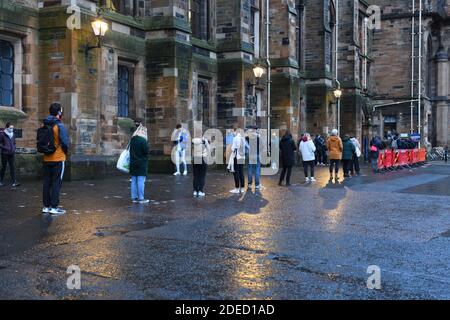 Glasgow, Scotland, UK. 30th November, 2020. Students at Glasgow University queue for the first of two Covid 19 tests which will determine whether it's safe to travel home for the Christmas holidays and prevent spreading the virus. Credit Douglas Carr/ Alamy Live News Stock Photo