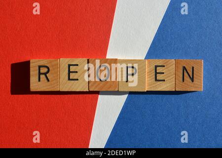 Reopen, word in wooden alphabet letters isolated on red, white and blue Stock Photo