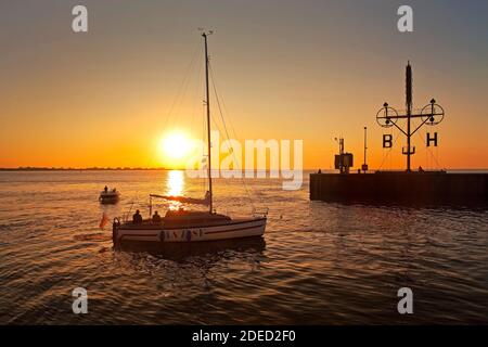 sailing boat, semaphore and signal mast of Bremerhaven at sunset, Germany, Bremen, Bremerhaven Stock Photo