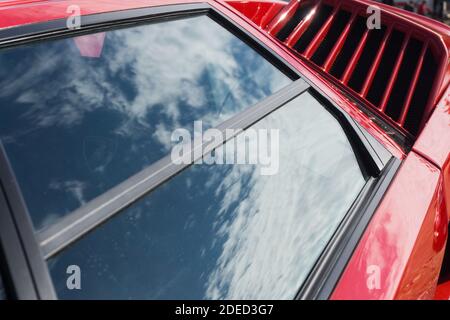 Close up detail of the strakes on the radiator intakes on a red ...