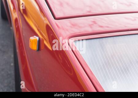 Close up detail of the headlights and bodywork on a red Lamborghini Countach 25th Anniversary Edition – photo taken outside Stock Photo