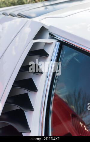 Close up of the right door pillar of a white Lamborghini Miura P400 S, showing the engine vents and window Stock Photo