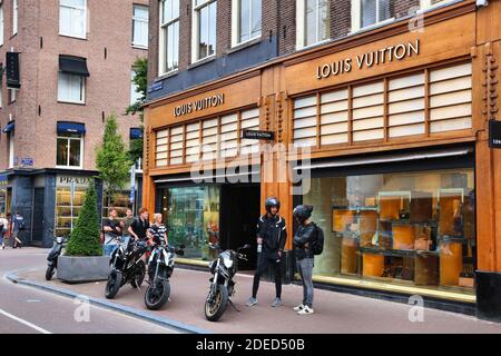 AMSTERDAM, NETHERLANDS - JULY 10, 2017: People visit Louis Vuitton