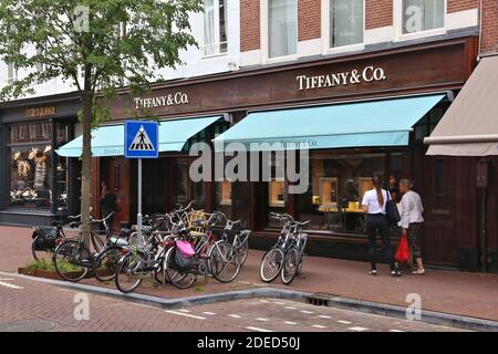 AMSTERDAM, NETHERLANDS - JULY 10, 2017: People visit Louis Vuitton