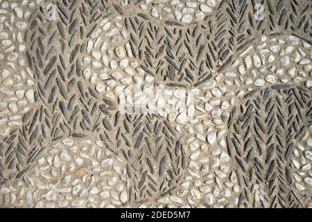 old natural stone pavement background, wall with pebbles stone texture Stock Photo