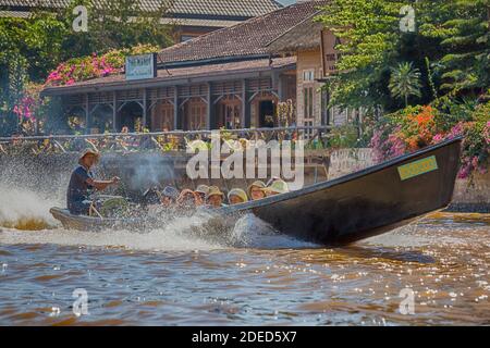Longboat ride going past the Manor Hotel at Inle Lake, Myanmar (Burma), Asia in February Stock Photo