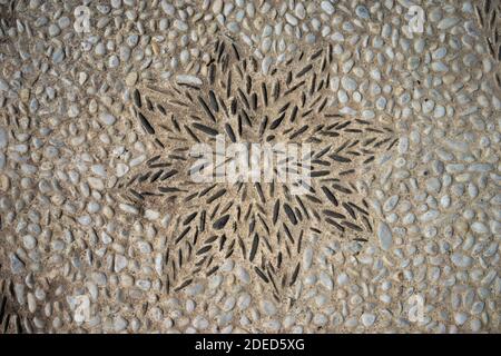 Sun flower made old natural stone pavement Stock Photo