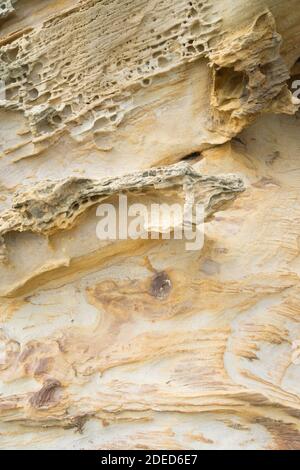 Sand and rock texture on the beach Stock Photo