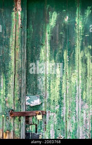 Turquoise  painted fence wood weathered with lock Stock Photo