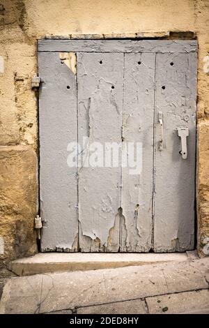 Small wooden basement door Stock Photo