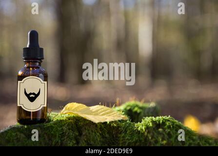 Natural beard Oil -  barbershop product photography. Beard oil in amber bottle. Stock Photo