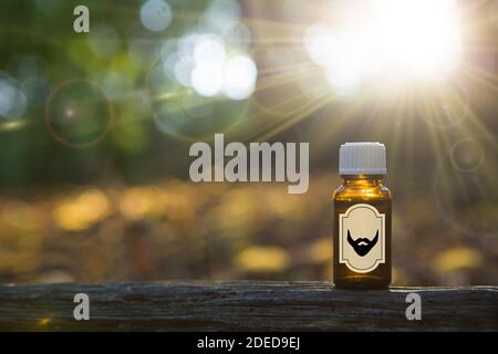 Beard oil in amber bottle - MOCK UP. Natural beard Oil -  barbershop product photography. Stock Photo