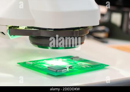 Printed circuit board under industrial microscope - quality control concept Stock Photo