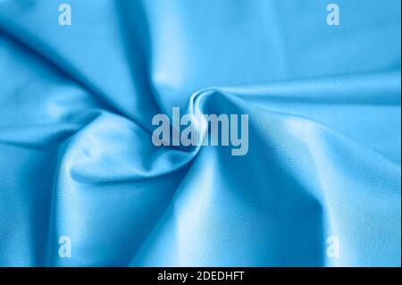 microfiber fabric blue color background with pleats, top view. toned classic blue color Stock Photo
