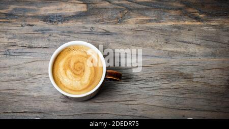 Cup of espresso coffee on wooden table. Top view. Stock Photo