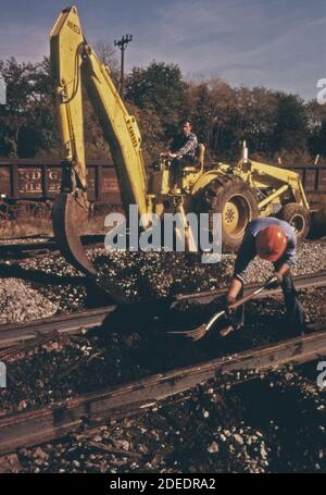 Southern Railway right-of-way work crew; removes old railroad ties and will replace them to improve the roadbed. ca. 1974 Stock Photo