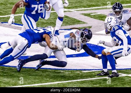November 29, 2020, Indianapolis, Indiana, USA: Tennessee Titans running back Derrick Henry (22) is tackled by Indianapolis Colts strong safety Khari Willis (37) in the game between the Tennessee Titans and the Indianapolis Colts at Lucas Oil Stadium, Indianapolis, Indiana. (Credit Image: © Scott Stuart/ZUMA Wire) Stock Photo