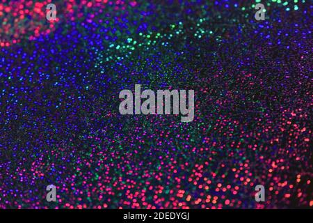 Multicolored shiny flickering abstract background. Blue, red, purple bokeh lights. Festive backdrop, texture. Stock Photo