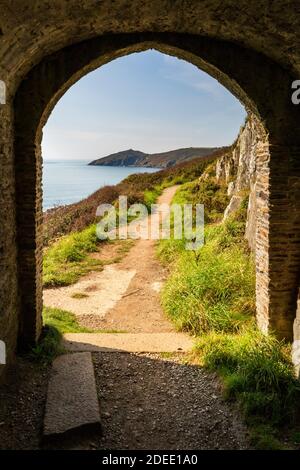 A view from inside Queen Adelaide's Chapel / Grotto at Penlee Point towards Rame Head, Cornwall England Stock Photo